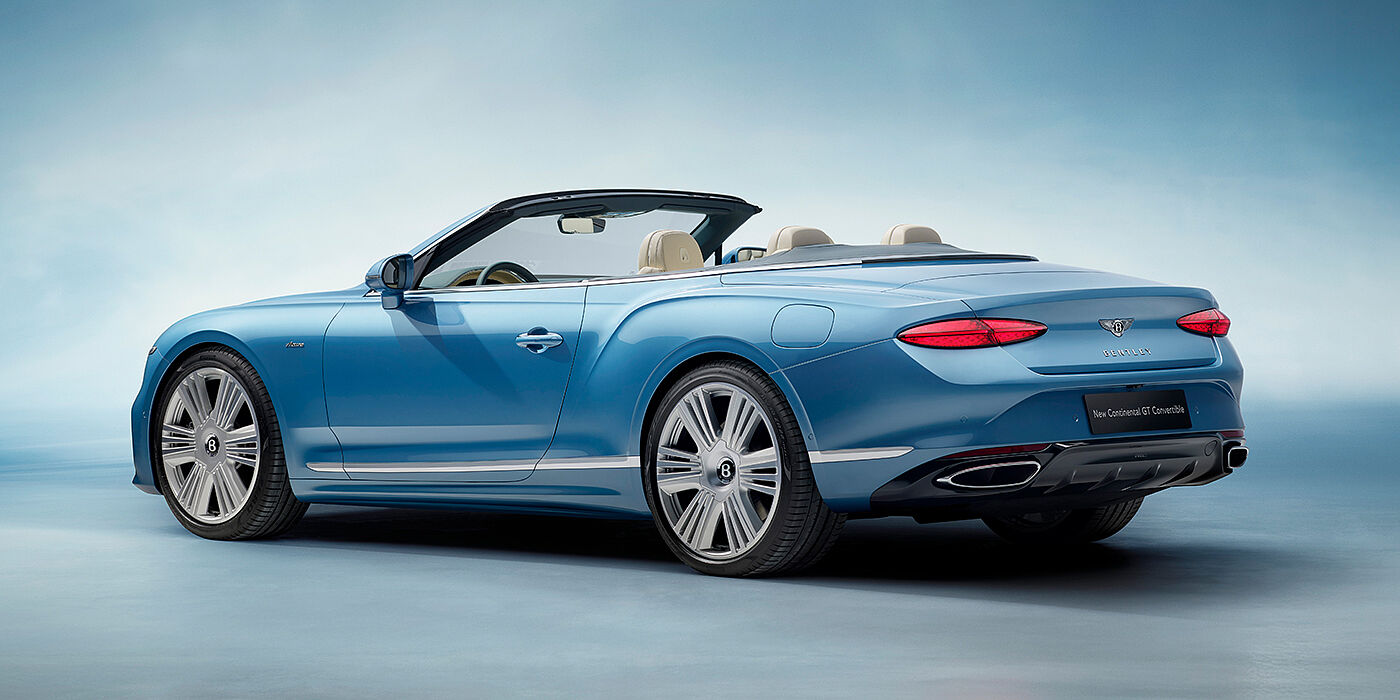 Bentley Bristol New Bentley Continental GTC Azure convertible rear view in Light Windsor blue paint with 22 inch ten spoke wheels and chrome exterior details