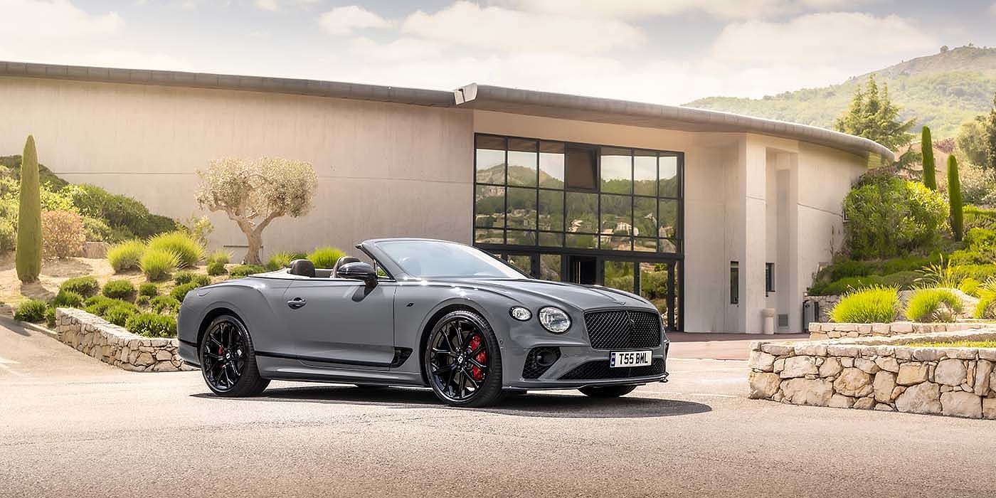 Bentley Bristol Bentley Continental GTC S convertible in Cambrian Grey paint front 34 static near house