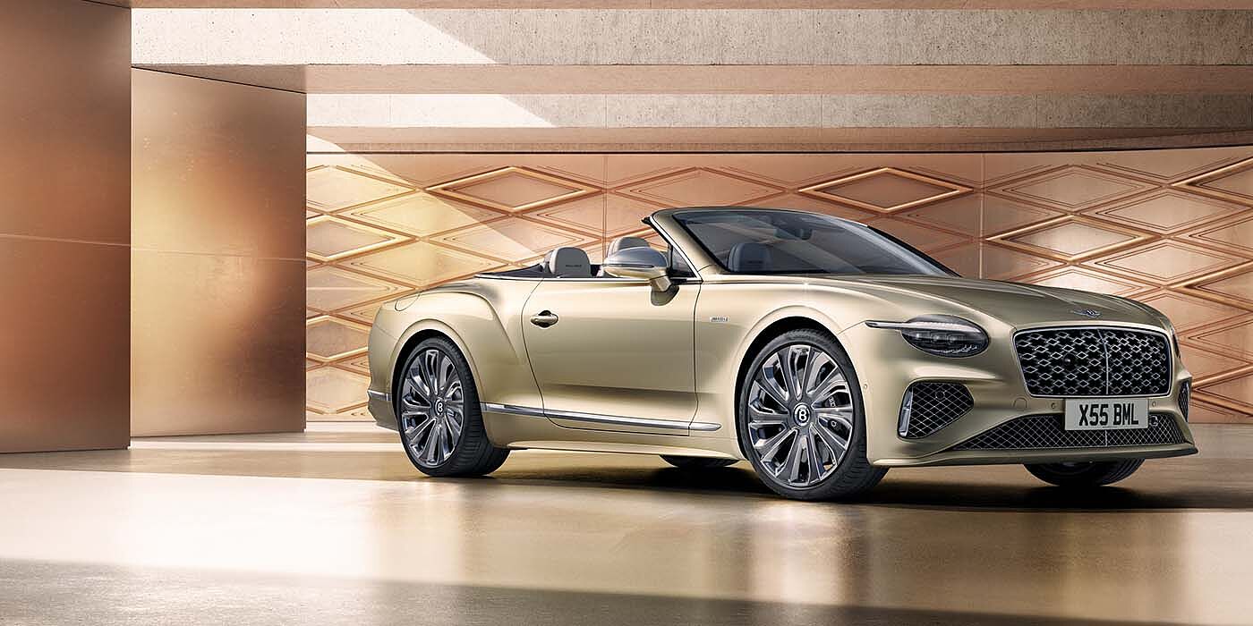 Bentley Bristol Bentley New Continental GTC Mulliner V8 hybrid front three quarters in Patina paint