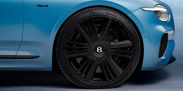 Bentley Bristol New Bentley Continental GTC Azure convertible front wheel detail with 22 inch black ten spoke wheel and dark chrome details against Light Windsor blue paint